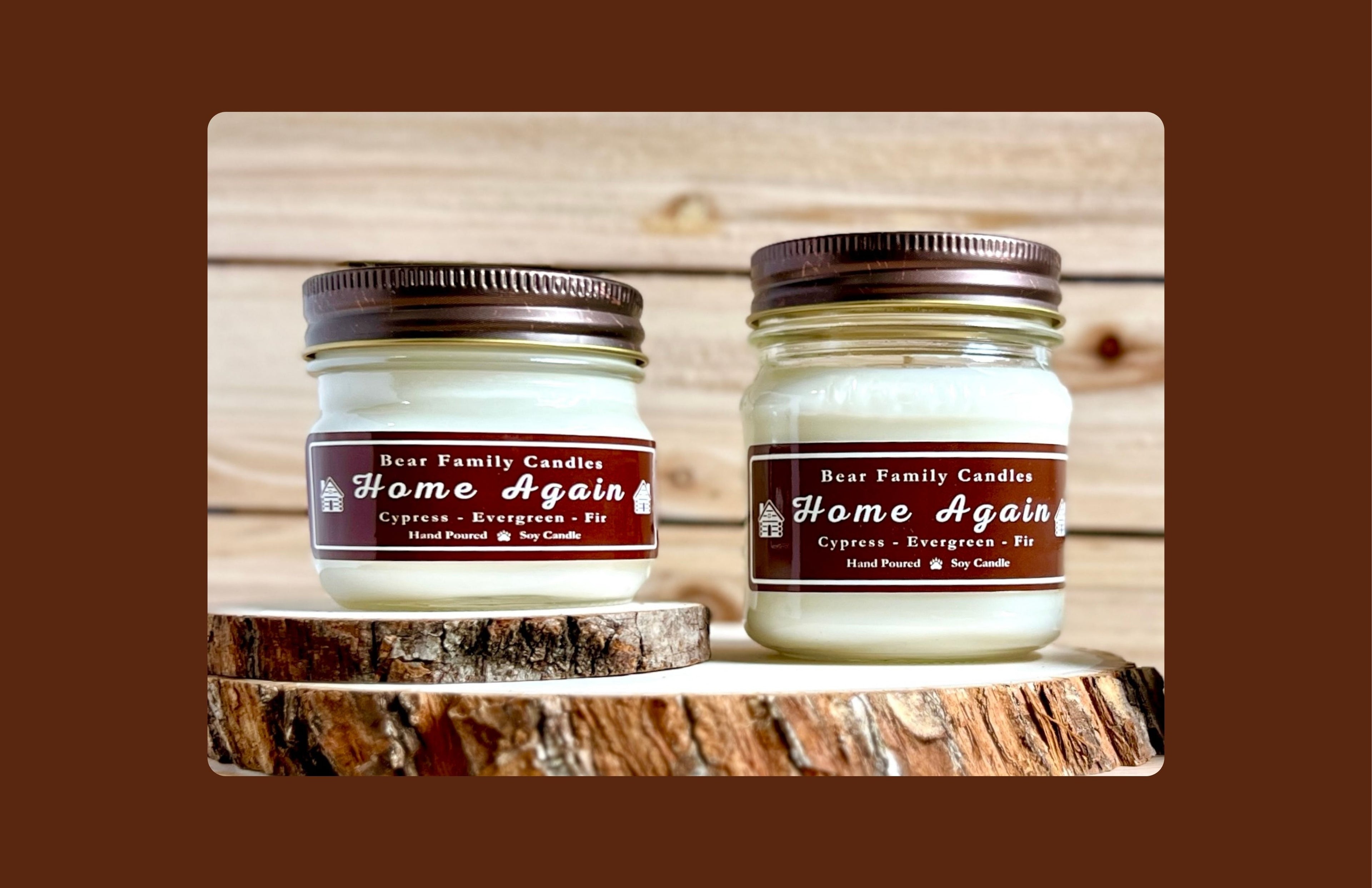 Two candles in square glass mason jars. 